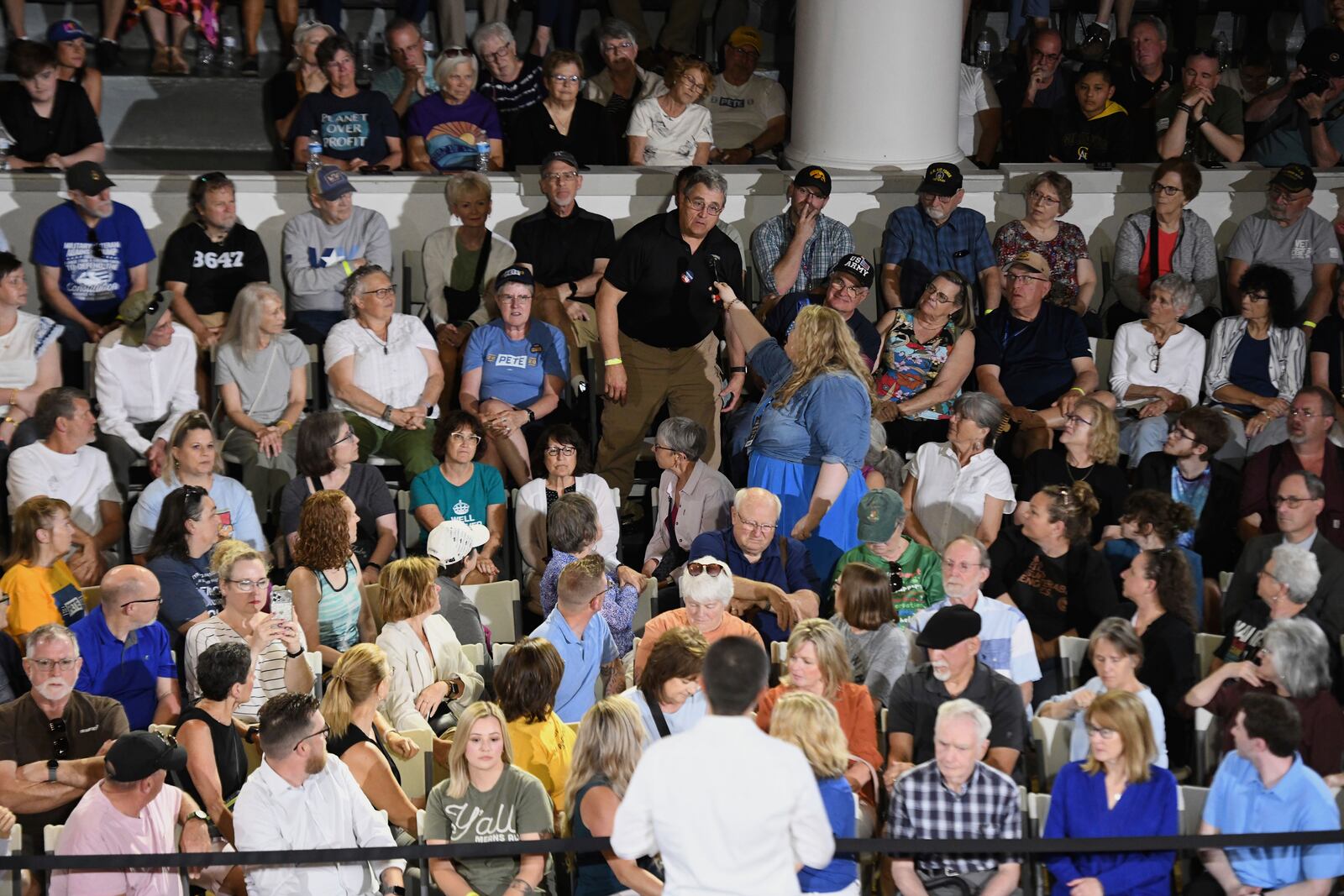 An audience member asks a question of former U.S. Secretary of Transportation Pete Buttigieg during a VoteVets Town Hall, Tuesday, May 13, 2025, in Cedar Rapids, Iowa. (AP Photo/Cliff Jette)