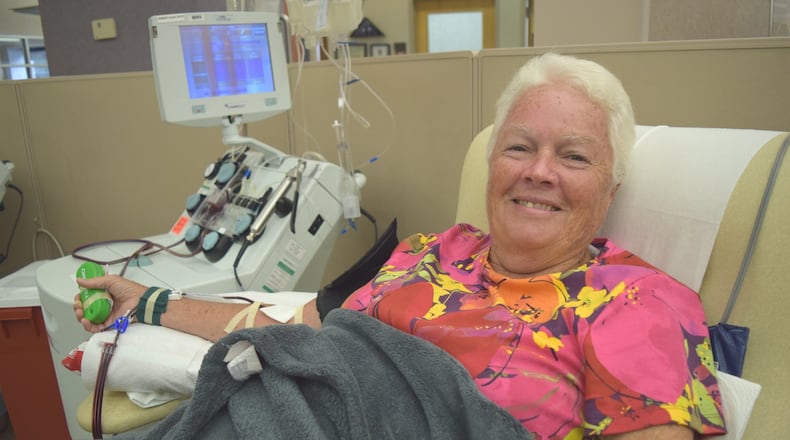 Kettering resident Katie Ellis makes her 500th lifetime blood donation at the Community Blood Center in Dayton. CONTRIBUTED