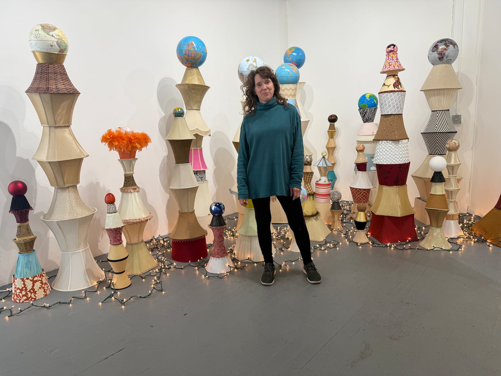 Lori Park with her "Earth Stacks", a found object assemblage that references climate change, the "overview effect", and the places the artist has lived around the world. HANNAH KASPER/CONTRIBUTED