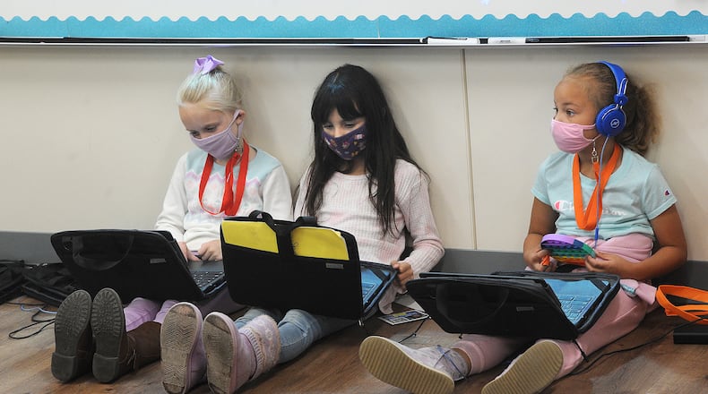 Fairborn Primary students work on computers in the classroom in April 2021. Schools' educational efforts were disrupted repeatedly in 2020-21 due to COVID-related closures, quarantines and staffing shortages. MARSHALL GORBY\STAFF
