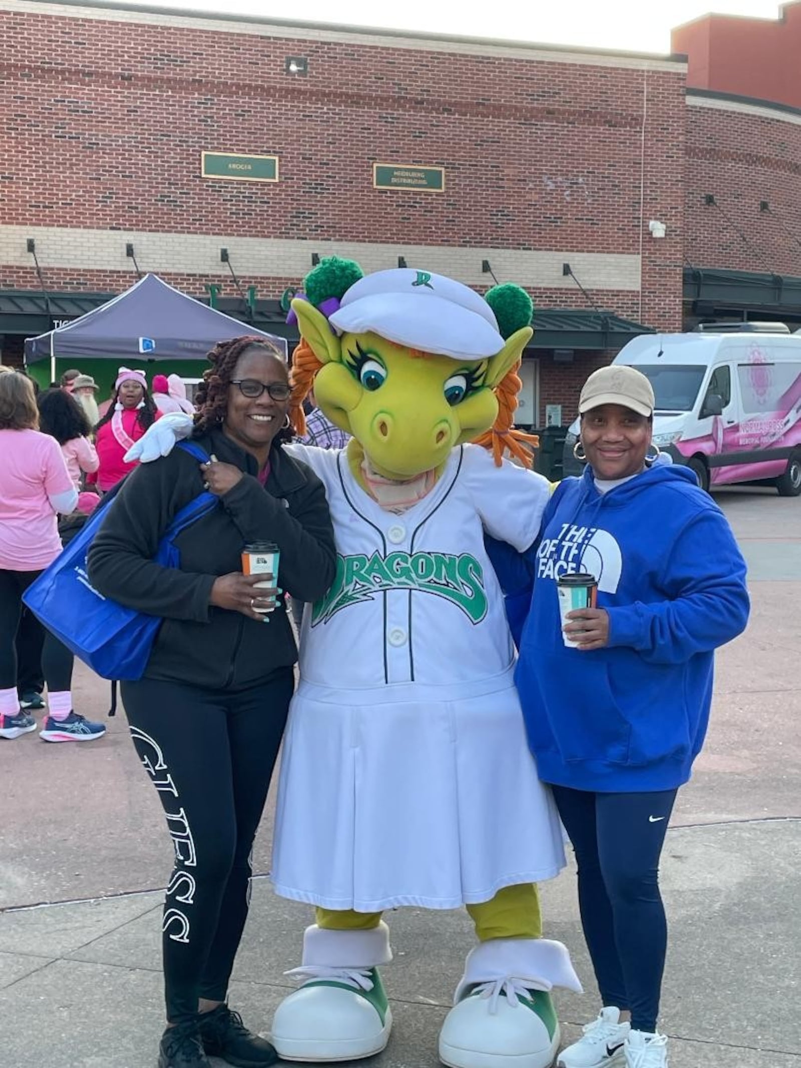 Dayton Dragons Mascot Gem makes new friends at the 28th Making Strides Against Breast Cancer of Dayton event Oct. 11 at Day Air Ballpark. PHOTO BY RUSSELL FLORENCE JR.