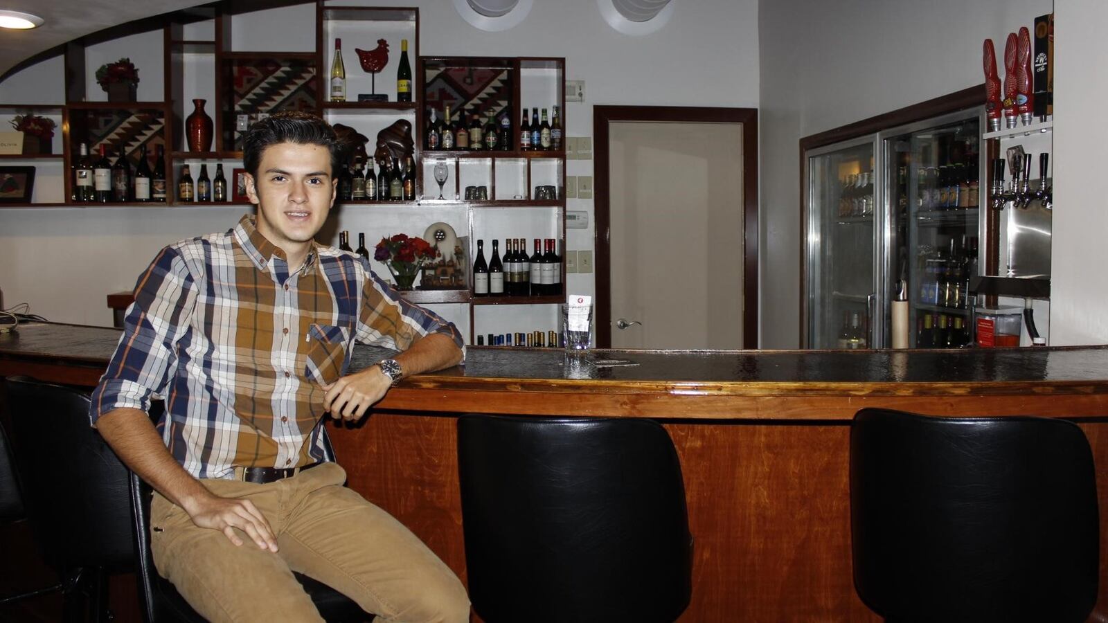 Cesar Santillan, nephew of co-owner Rafael Santillan, sits at the bar at Nelly’s restaurant, 79 S. Main St. Centerville. CONTRIBUTED