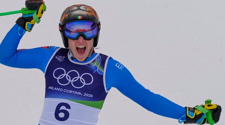 Italy's Federica Brignone reacts in the finish area, during an alpine ski, women's super-G race, at the 2026 Winter Olympics, in Cortina d'Ampezzo, Italy, Thursday, Feb. 12, 2026. (AP Photo/Andy Wong)