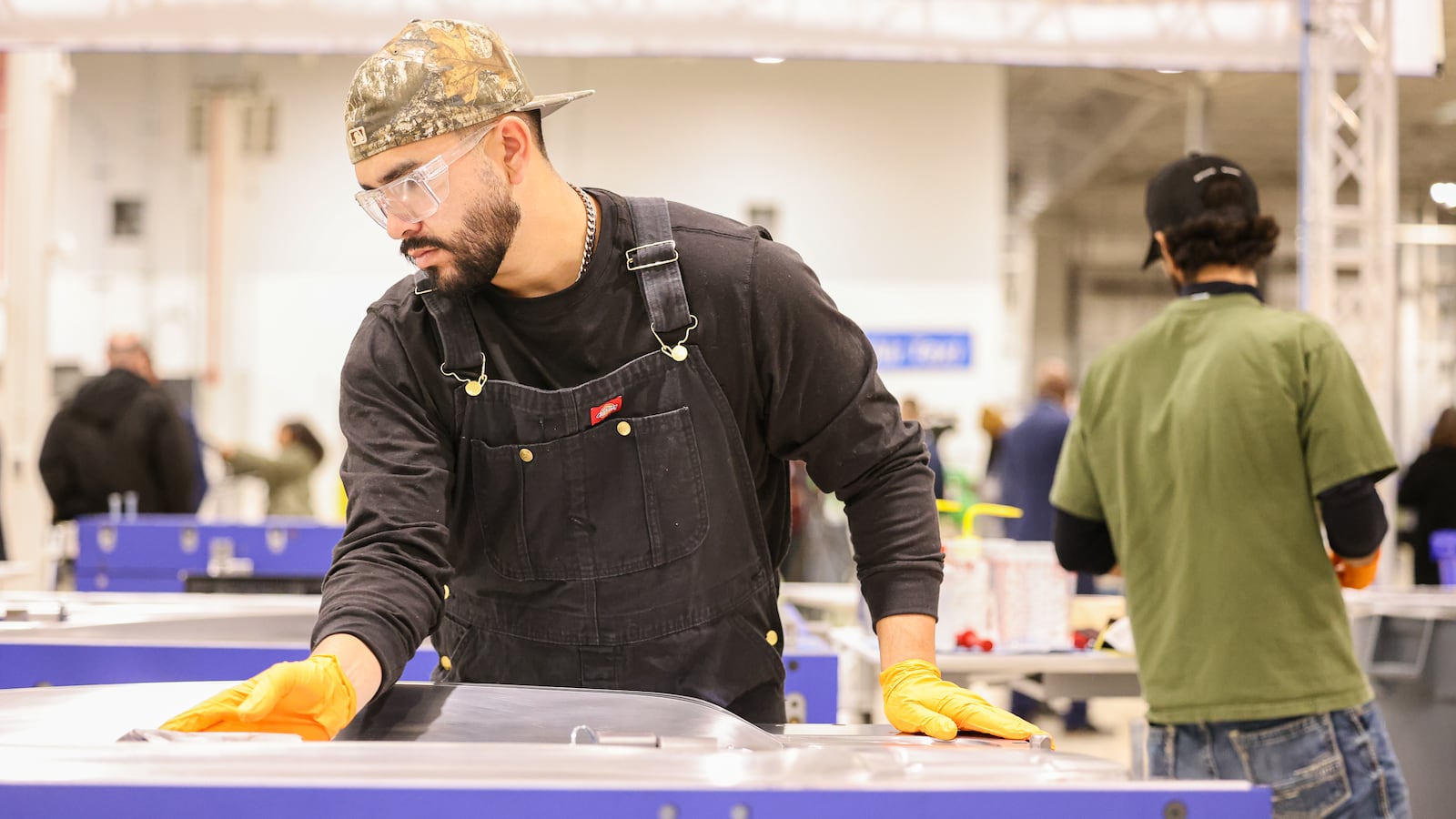 A Joby Aviation employee works in a propeller molding area at the company's new facility near Dayton International Airport on Monday, Nov. 10. BRYANT BILLING/STAFF