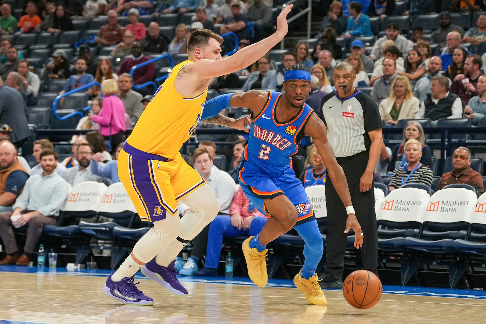 Oklahoma City Thunder guard Shai Gilgeous-Alexander, right, drives past Los Angeles Lakers guard Luka Doncic, left, during the second half of an NBA basketball game, Tuesday, April 8, 2025, in Oklahoma City. (AP Photo/Kyle Phillips)