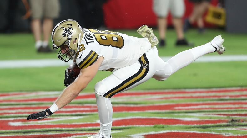 New Orleans Saints tight end Adam Trautman (82) scores against the Tampa Bay Buccaneers during the first half of an NFL football game Sunday, Nov. 8, 2020, in Tampa, Fla. (AP Photo/Mark LoMoglio)