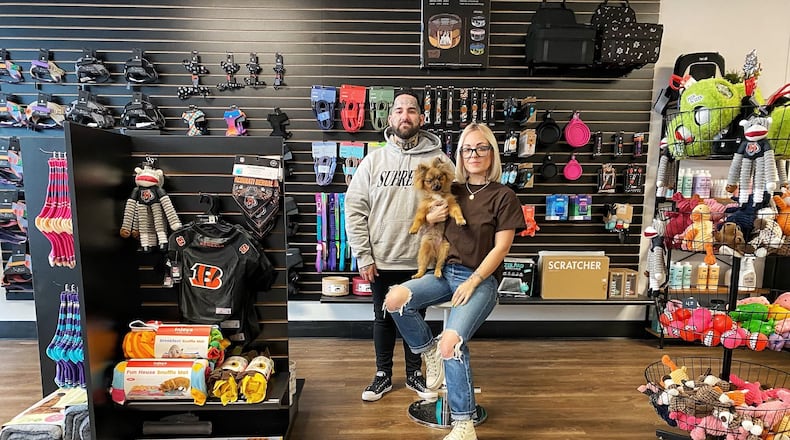 Norman’s Pet Supply Co is located at 225 N. Main Street in Dayton. Pictured are owners Donny Bussinger and Brittany Clausing with her dog, Norman. (CONTRIBUTED PHOTO).