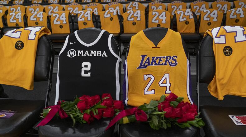 Flowers were placed on courtside seats in honor of Kobe Bryant and his daughter Gianna at the Staples Center in Los Angeles before the Los Angeles Lakers played the Portland Trail Blazers on Jan. 31. PHILIP CHEUNG / THE NEW YORK TIMES