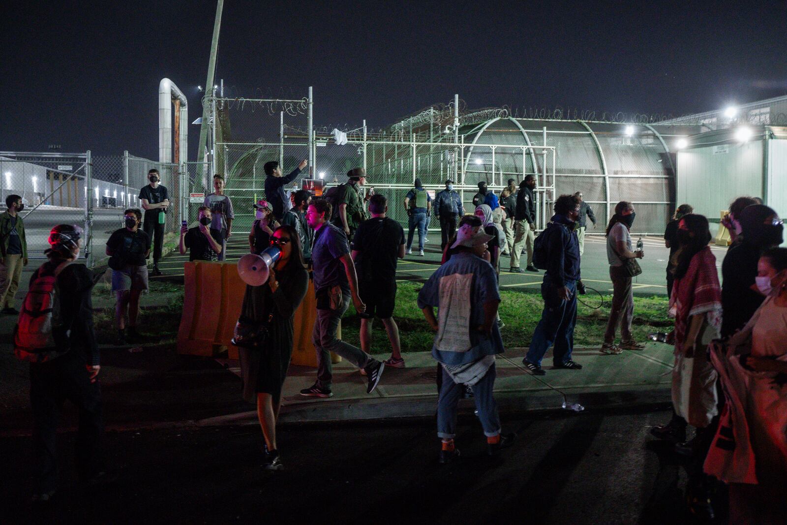 Protesters gather outside the Delaney Hall Detention Facility during protests over federal immigration enforcement raids on Thursday, June 12, 2025, in Newark, N.J. (AP Photo/Olga Fedorova)