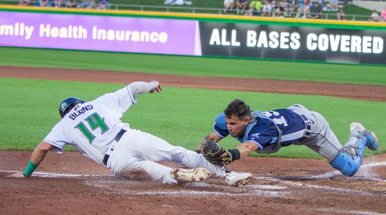 Dayton's Connor Burns is safe at home with the Dragons' first run in a game against West Michigan Whitecaps last summer at Day Air Ballpark. Contributed photo / Jeff Gilbert
