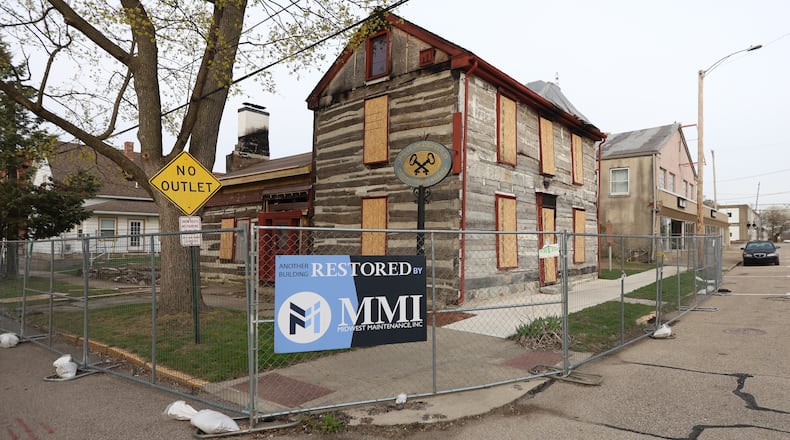 Overfield Tavern Museum in Troy, which was damaged in a fire last December, recently held an auction for damaged artifacts, with proceeds benefiting ongoing recovery efforts. BRYANT BILLING / STAFF