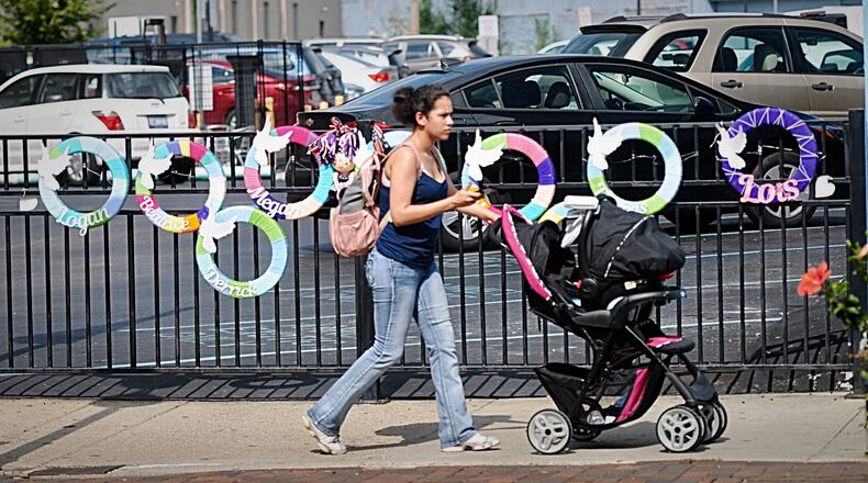 Makeshift memorials can still be seen in the Oregon District nearly three months after the Aug. 4 mass shooting. Residents and business owners say they are still dealing with the trauma caused by the killings.