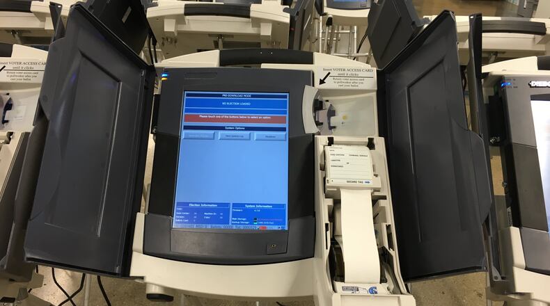 An electronic touch screen voting machine is set up for testing at the Montgomery County Board of Elections. The paper spool will be enclosed at the polls. LYNN HULSEY/STAFF