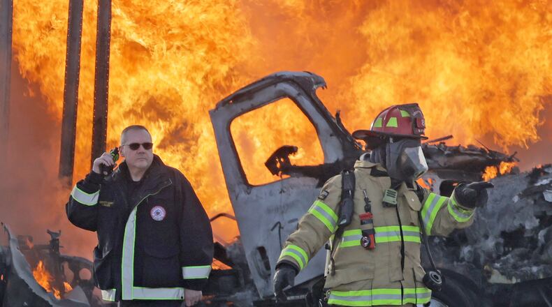 A semi truck and an SUV burst into flames after colliding on Ohio 41 at the Interstate 70 overpass Friday, Feb. 7, 2025. Both occupants escaped with minor injuries. Ohio 41 was closed for several hours while wreck was cleaned up. BILL LACKEY/STAFF