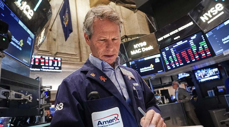 Trader Robert Charmak works on the floor of the New York Stock Exchange, Monday, Feb. 2, 2026. (AP Photo/Richard Drew)