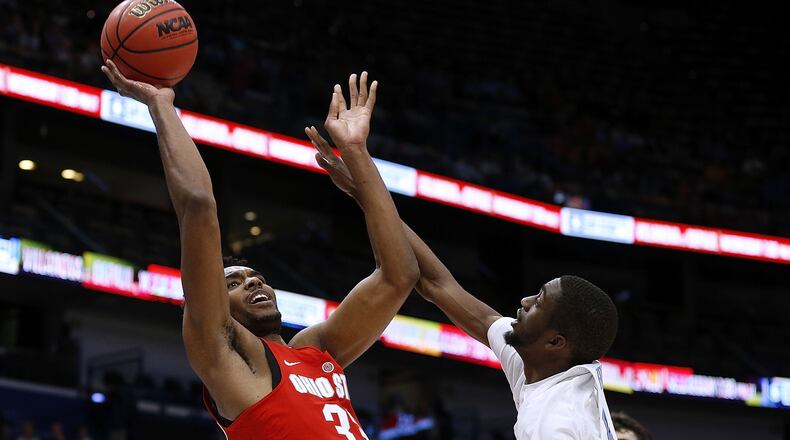 NEW ORLEANS, LA - DECEMBER 23: Keita Bates-Diop #33 of the Ohio State Buckeyes shoots against Brandon Robinson #4 of the North Carolina Tar Heels during the first half of the CBS Sports Classic at the Smoothie King Center on December 23, 2017 in New Orleans, Louisiana.  (Photo by Jonathan Bachman/Getty Images)