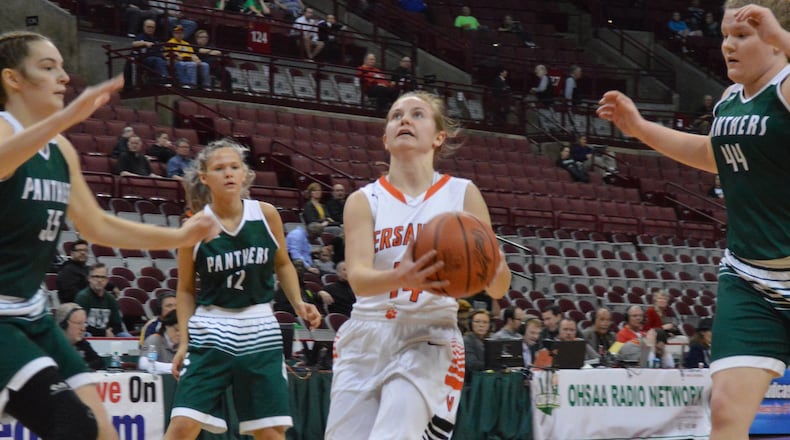 Caitlin McEldowney of Versailles (with ball). Versailles defeated Elyria Catholic 63-47 in a girls high school basketball D-III state semifinal at OSUâs Schottenstein Center on Thursday, March 15, 2018. ERIC FRANTZ / CONTRIBUTOR