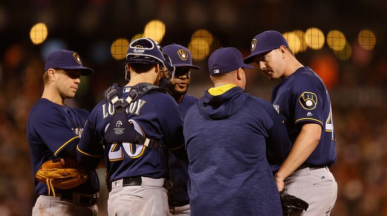 SAN FRANCISCO, CA - JUNE 14: Corey Knebel #46 of the Milwaukee Brewers talks to Pitching Coach Derek Johnson #36 of the Milwaukee Brewers during the fifth inning against the San Francisco Giants at AT&T Park on June 14, 2016 in San Francisco, California. (Photo by Lachlan Cunningham/Getty Images)