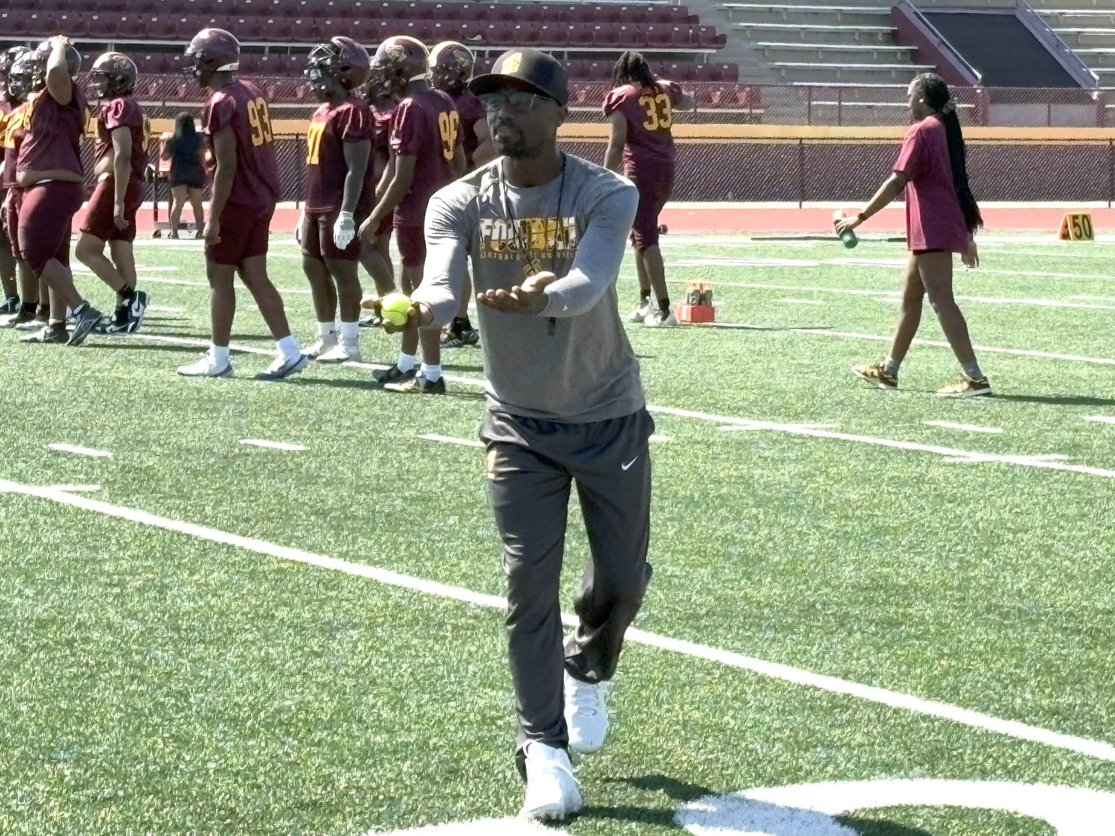 Santonio Holmes – the former Ohio State star receiver and NFL veteran who was named the MVP of Super Bowl XLIII after his game-winning TD catch for  the Pittsburgh Steelers against Arizona – is now the new wide receivers coach at Central State. At the Marauders’ first day of practice Wednesday, he gave some spirited instruction during a receiving drill. TOM ARCHDEACON / CONTRIBUTED PHOTO