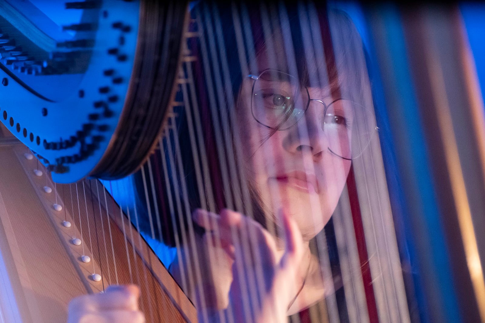 A member of the Vienna Symphony Orchestra plays on harp during "The Blue Danube" waltz as it is transmitted into deep space towards Voyager 1. in Vienna, Austria, on Saturday, May 31, 2025. (AP Photo/Denes Erdos)