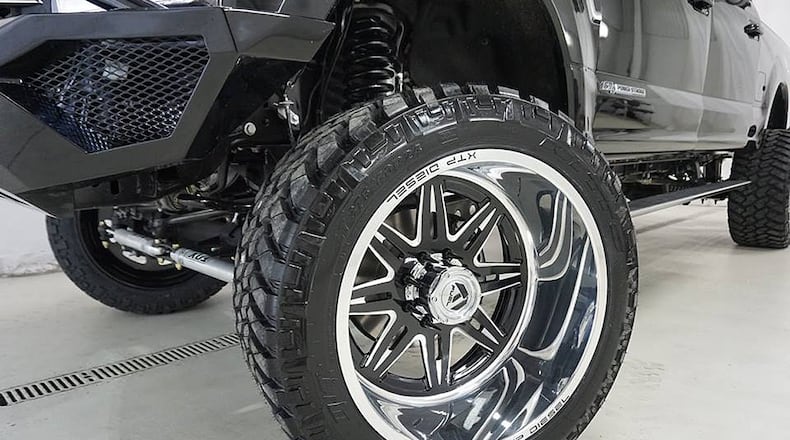 A close-up of the 24-by-14-inch wheels from Fuel Forged and 375/40 R 24 tires from Nitto on a 2017 Ford F350 diesel 4-wheel drive pickup truck after it was modified XTP Diesel & Offroad of Beavercreek. CONTRIBUTED