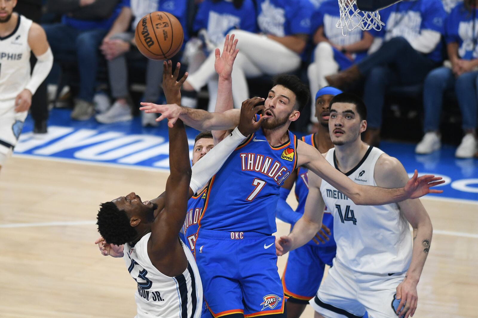 Memphis Grizzlies forward Jaren Jackson Jr., left, shoots near Oklahoma City Thunder forward Chet Holmgren, right, during the first half in Game 1 of an NBA first-round playoff series, Tuesday, April 22, 2025, in Oklahoma City. (AP Photo/Kyle Phillips)