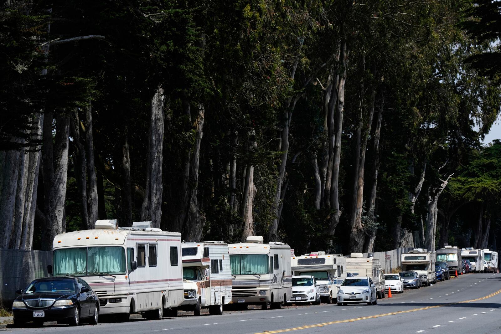 Parked RVs are seen on Lake Merced Boulevard in San Francisco, Tuesday, July 15, 2025. (AP Photo/Godofredo A. Vásquez)