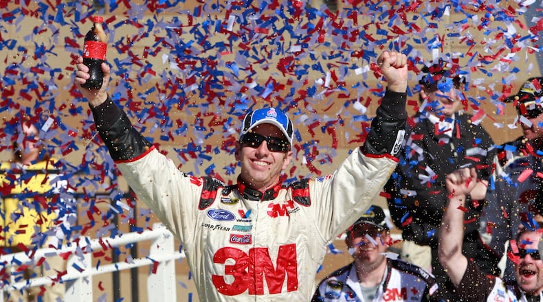 FILE - Greg Biffle celebrates in victory lane after winning the NASCAR Sprint Cup Series auto race at Kansas Speedway on Sunday, Oct. 3, 2010, in Kansas City, Kan. (AP Photo/Orlin Wagner, File)