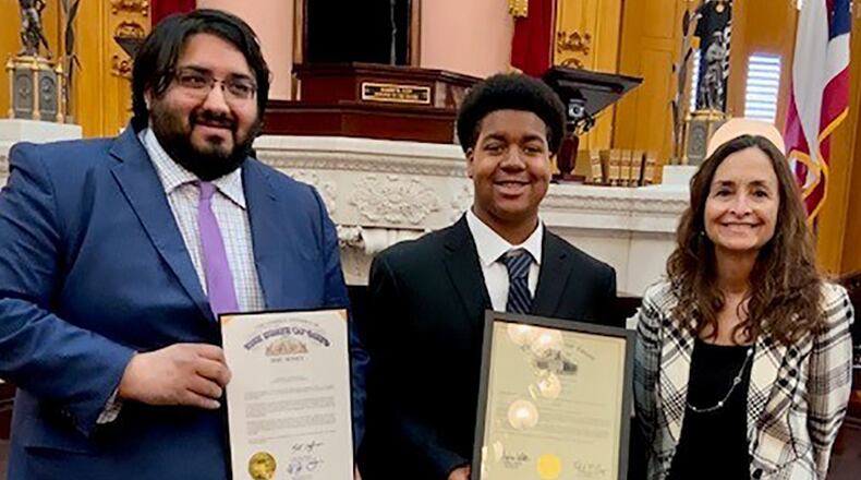 Jamari Jones (center) receives the 2022 Ohio Military Youth of the Year Award from state Sen. Niraj Antani (left) and state Rep. Andrea White on April 6 in Dayton. The Wright-Patterson Air Force Base teenager now moves on to compete at the regional level in Chicago. CONTRIBUTED PHOTO