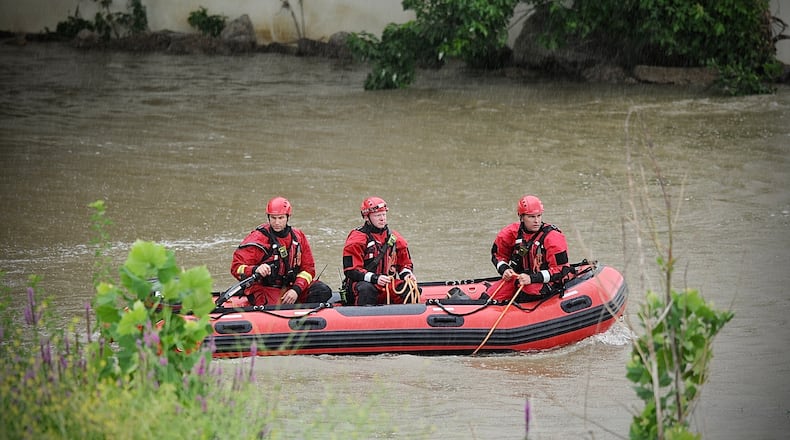 Dayton Fire Department searches the Great Miami River near the Monument Avenue bridge early Friday morning, July 8, 2022. MARSHALL GORBY/STAFF