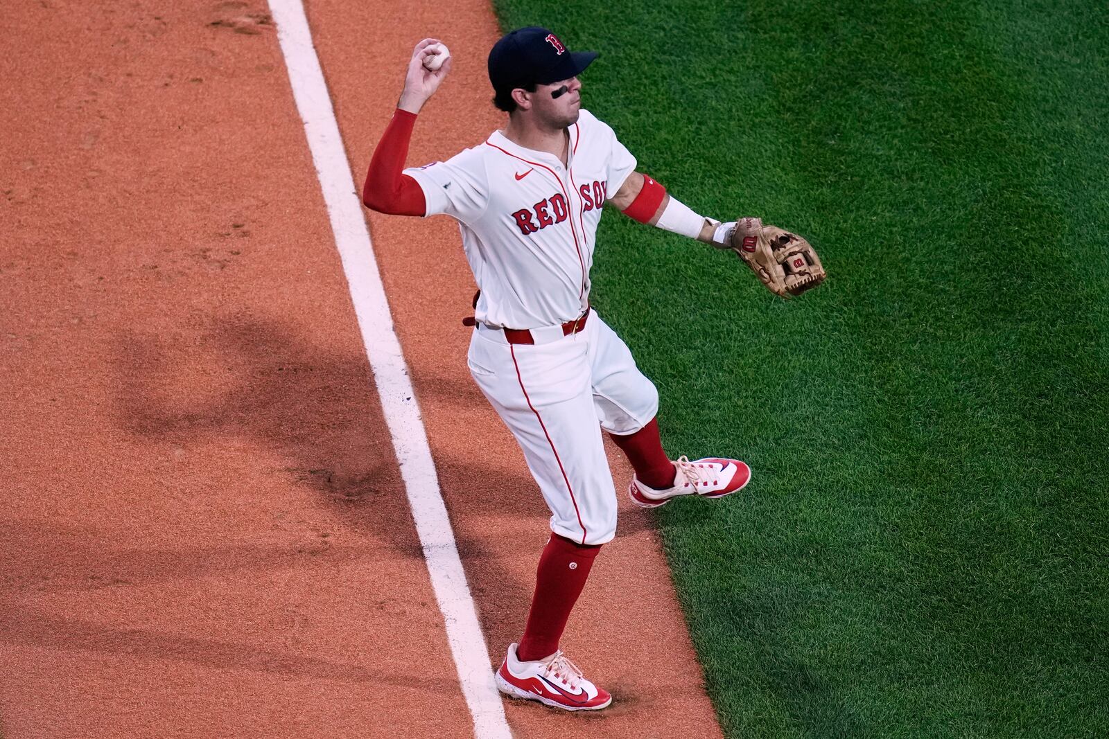 Boston Red Sox third baseman Marcelo Mayer fields a single by Cincinnati Reds' Christian Encarnacion-Strand during the third inning of a baseball game at Fenway Park, Tuesday, July 1, 2025, in Boston. (AP Photo/Charles Krupa)