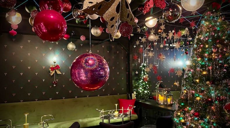 The cocktail lounge in the basement of Cherry Street Bottle Shop in Troy will be transformed into a Christmas pop-up bar this holiday season. NATALIE JONES/STAFF