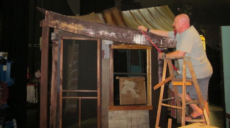 More than 150 volunteers work on FutureFest. Here, Chris Newman puts the finishing touches on a set. CONTRIBUTED