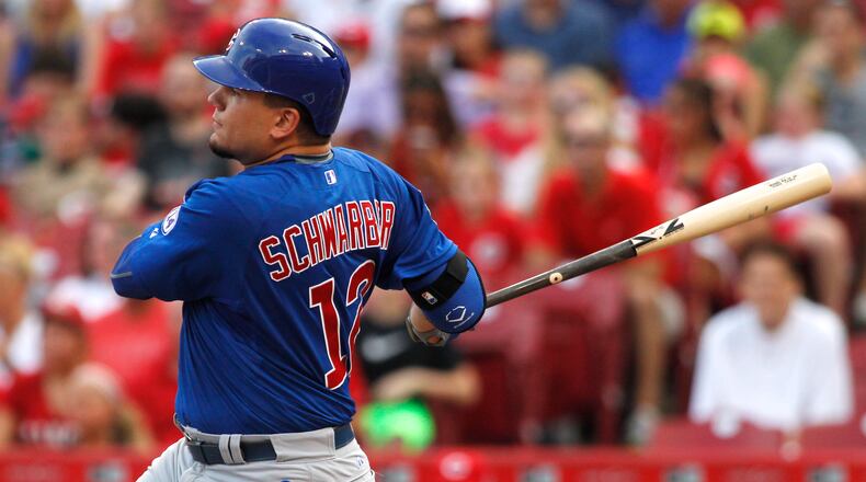 The Cubs’ Kyle Schwarber singles in the first inning against the Reds on Monday, July 20, 2015, at Great American Ball Park in Cincinnati. David Jablonski/Staff