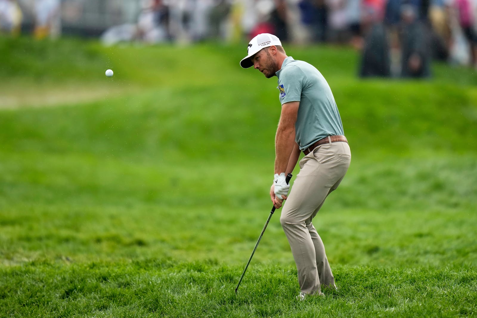 Sam Burns hits from the rough on the 11th hole during the final round of the U.S. Open golf tournament at Oakmont Country Club Sunday, June 15, 2025, in Oakmont, Pa. (AP Photo/Seth Wenig)