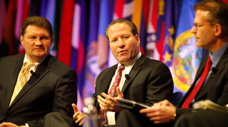 Speaking on the University of Dayton R.I.S.E. XI panel at the UD Arena in 2011, UD grad David Kudla, CEO of Mainstay Capital management, is seen in the center. Panelist Barry James, of James Investment Research, was on his left, while session moderator Keith Wirtz, Fifth Third Asset management, Inc., was on his right. FILE