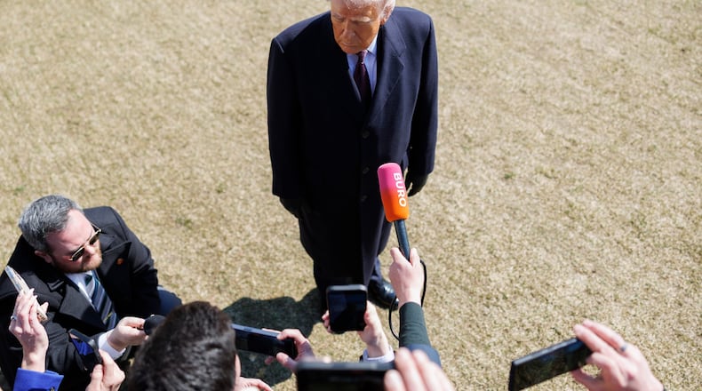President Donald Trump speaks to reporters before departing on Marine One from the South Lawn of the White House, Friday, Feb. 27, 2026, in Washington. (AP Photo/Tom Brenner)