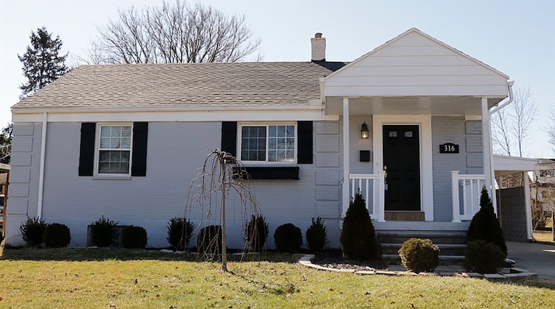 The brick ranch with 2 bedrooms has about 890 sq. ft. of living space plus a full, finished basement. The property includes a 1-car, detached garage with covered carport. CONTRIBUTED PHOTO BY KATHY TYLER