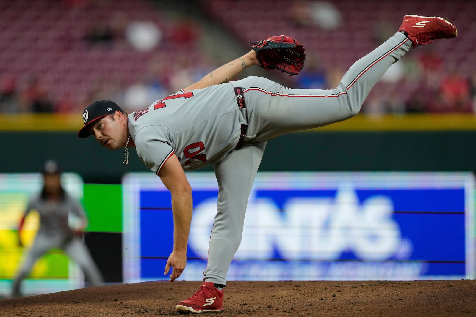 Washington Nationals pitcher Mitchell Parker throws during the first inning of a baseball game against the Cincinnati Reds, Friday, May 2, 2025, in Cincinnati. (AP Photo/Carolyn Kaster)