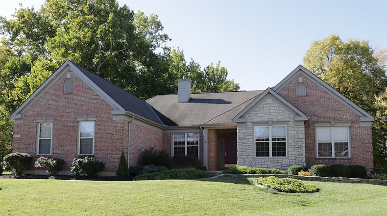 The brick house has about 2,410 sq. ft. of living space on the main level and about another 1,200 finished square feet in the lower level. Open social areas and spacious bedrooms are on the main level of this brick ranch. CONTRIBUTED PHOTO BY KATHY TYLER