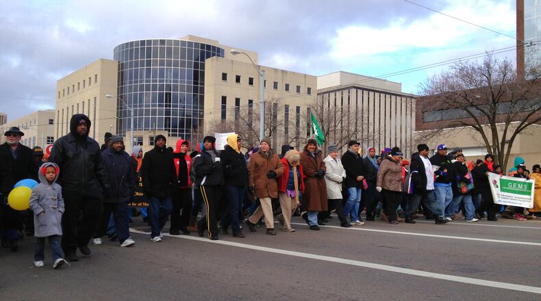 Marchers head to the convention center in Dayton in honor of MLK Day Jan. 21, 2013. NICK GRAHAM / STAFF