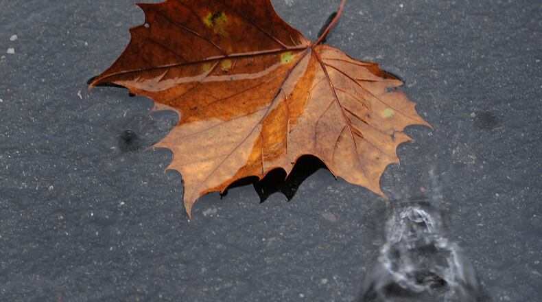 A rain drop hits a puddle in Greene County on Thursday, Oct. 29, 2020, as heavy rains from the Hurricane Zeta air mass soaked the area. MARSHALL GORBY\STAFF