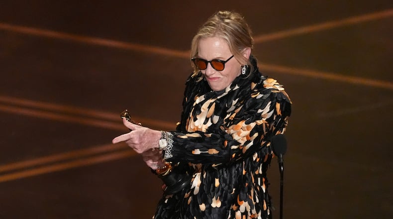Amy Madigan accepts the award for actress in a supporting role for "Weapons" during the Oscars on Sunday, March 15, 2026, at the Dolby Theatre in Los Angeles. (AP Photo/Chris Pizzello)