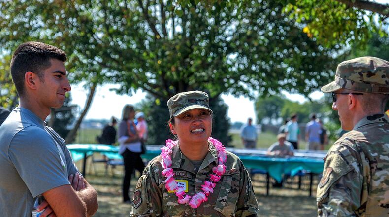 Col. Tina Nguyen advises a junior officer and trainee at the third annual Wright-Patterson Young Professionals Picnic Aug. 8. Nguyen was one of about 40 senior leaders who spent time talking with young professionals to help them make connections and guide them in their careers.
