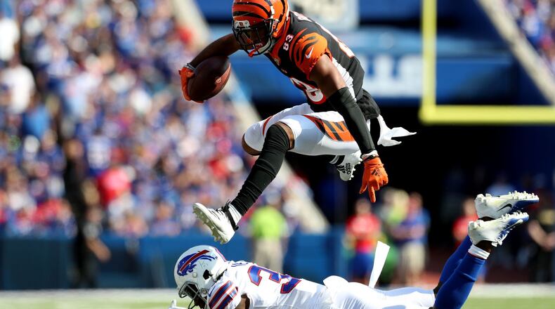 ORCHARD PARK, NEW YORK - SEPTEMBER 22: Tyler Boyd #83 of the Cincinnati Bengals leaps over Siran Neal #33 of the Buffalo Bills during a game at New Era Field on September 22, 2019 in Orchard Park, New York. (Photo by Bryan M. Bennett/Getty Images)