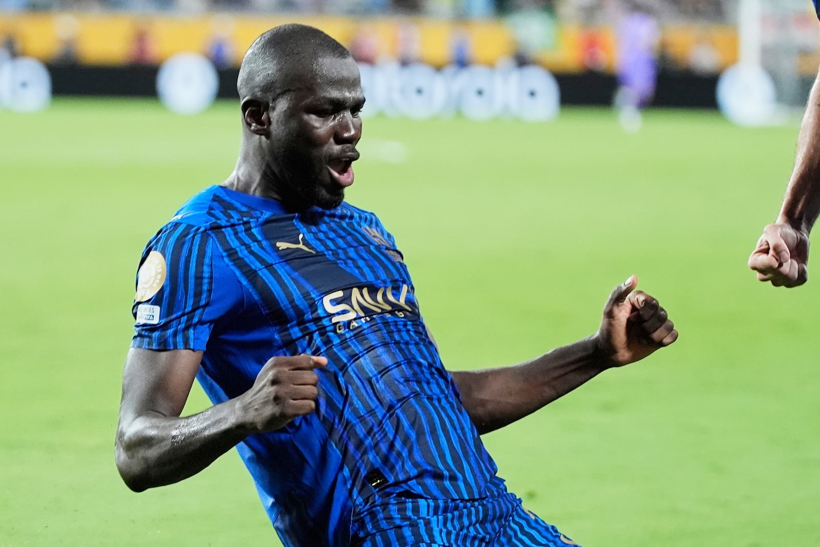 Al Hilal's Kalidou Koulibaly celebrates after scoring his team's third goal during the Club World Cup round of 16 soccer match between Manchester City and Al Hilal in Orlando, Fla., Monday, June 30, 2025. (AP Photo/John Raoux)