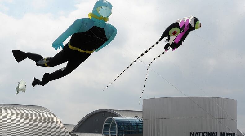 People Interested in Getting Stuff Aloft (PIGS) take advantage of a windy spring Monday March 27, 2023, to fly their large kites at the National Museum of the United States Air Force at Wright-Patterson Air Force Base. MARSHALL GORBY\STAFF