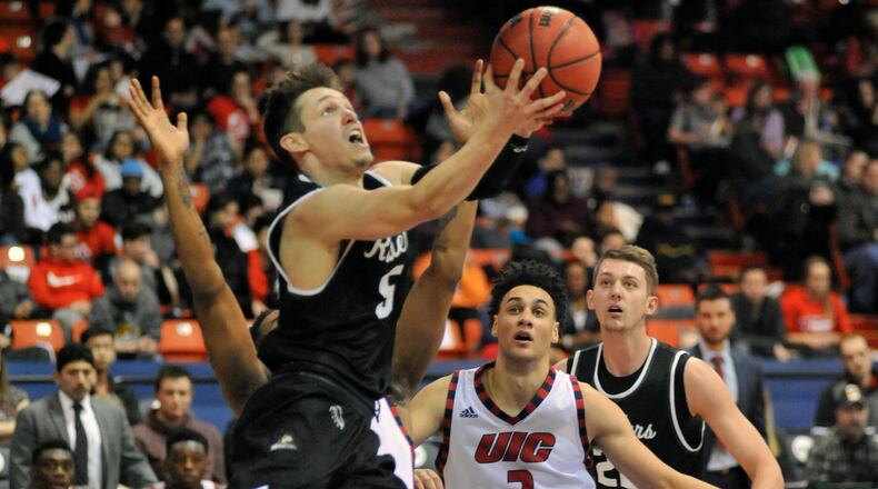 Wright State senior guard Mike La Tulip drives for a layup during Sunday’s game at UIC. JAY MORRISON/STAFF