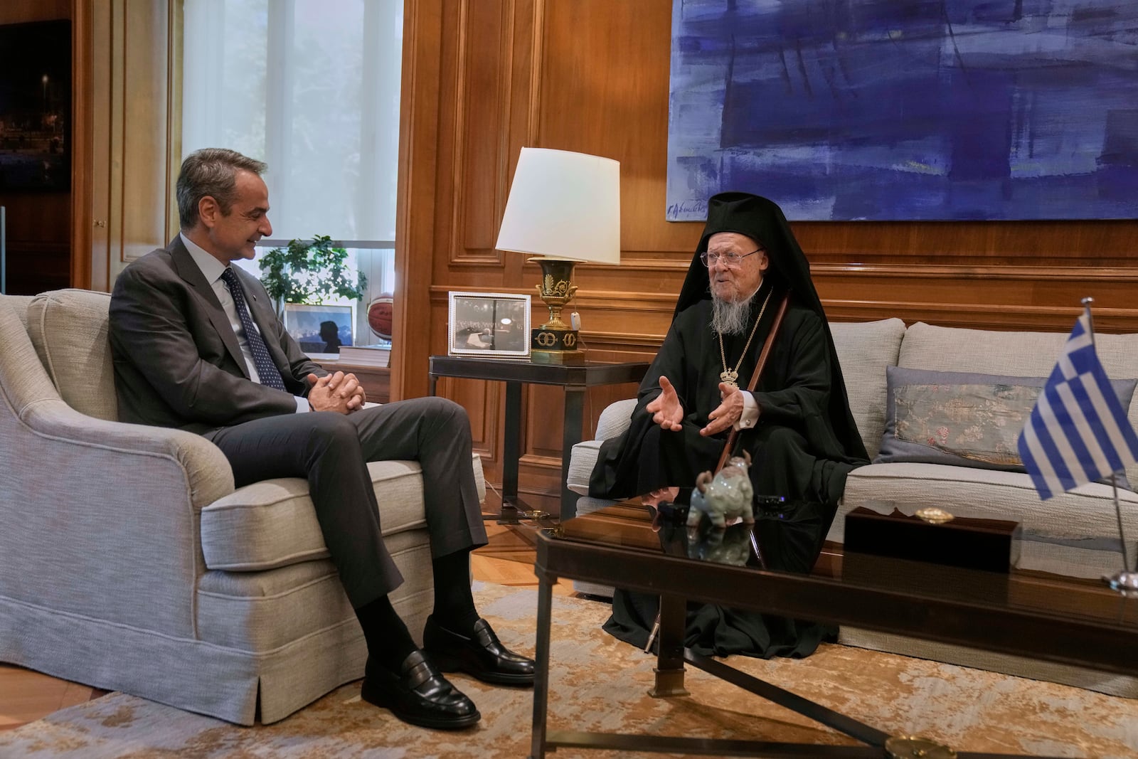 Orthodox Ecumenical Patriarch Bartholomew, right, speaks during his meeting with Greece's Prime Minister Kyriakos Mitsotakis, in Athens, on Thursday May 8, 2025. (AP Photo/Petros Giannakouris)