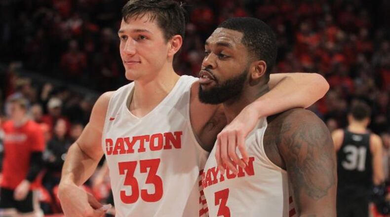Dayton’s Ryan Mikesell and Trey Landers leave the court after a victory against Davidson on Friday, Feb. 28, 2020, at UD Arena. David Jablonski/Staff